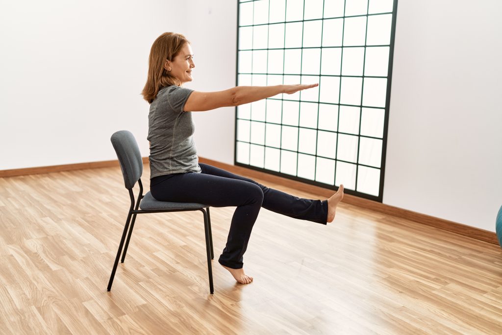 Middle age caucasian woman smiling confident training at sport center